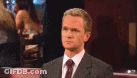Man In Suit And Tie Looking GIF
