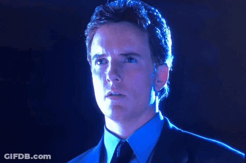 Man In Suit And Tie Looking GIF