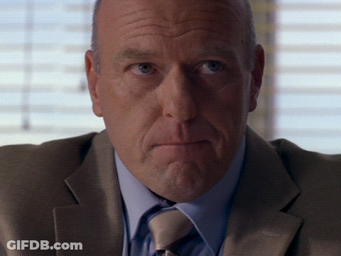 Man In Suit And Tie Looking Serious GIF