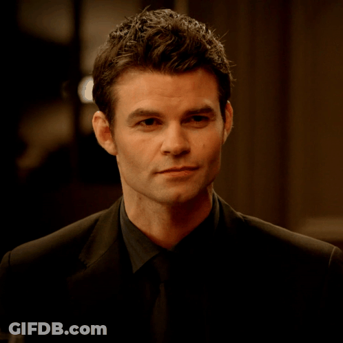 Man In Suit And Tie Looking Serious GIF