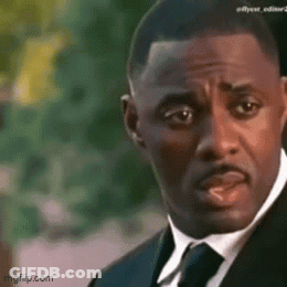 Man In Suit And Tie Looking Serious GIF