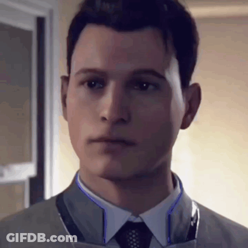 Man In Suit And Tie Looking Serious GIF