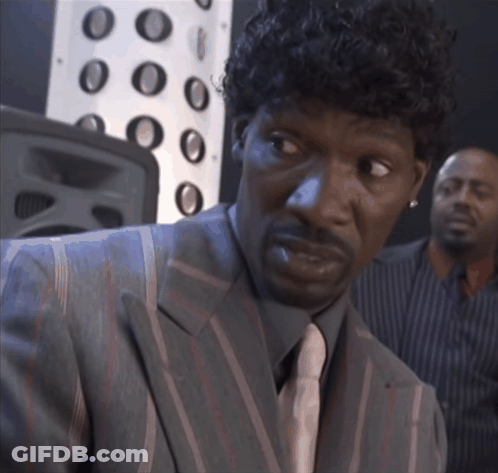Man In Suit And Tie Looking Sideways GIF