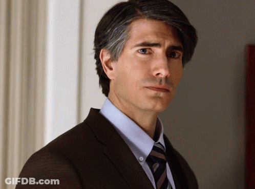 Man In Suit And Tie Looking Sideways GIF