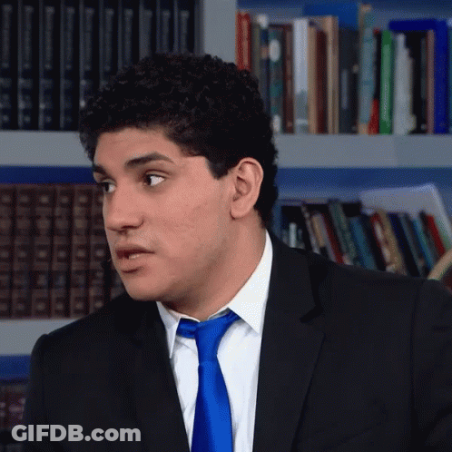 Man In Suit And Tie Looking To Side GIF
