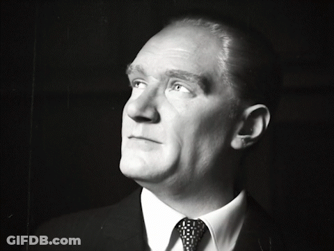 Man In Suit And Tie Looking Up At Sky GIF