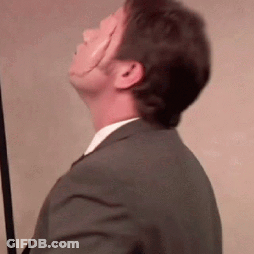 Man In Suit And Tie Looking Up GIF