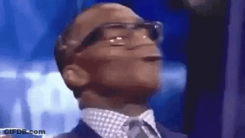 Man In Suit And Tie Looking Up With Glasses GIF
