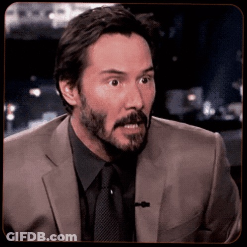 Man In Suit And Tie Looks Surprised GIF