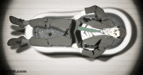 Man In Suit And Tie Lying In Bathtub GIF
