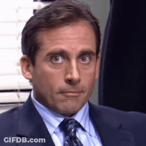 Man In Suit And Tie Making A Face GIF