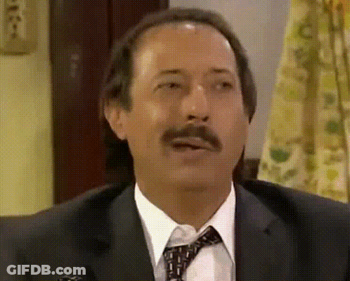 Man In Suit And Tie Making A Face GIF