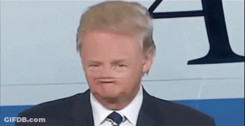 Man In Suit And Tie Making A Face GIF