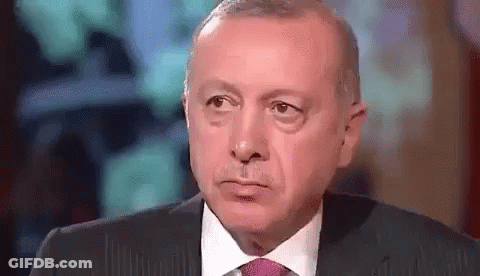 Man In Suit And Tie Making A Face GIF