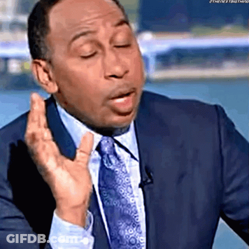 Man In Suit And Tie Making A Face GIF