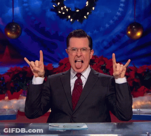 Man In Suit And Tie Making Devil Horns GIF