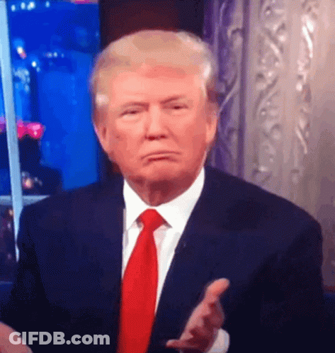 Man In Suit And Tie Making Face GIF