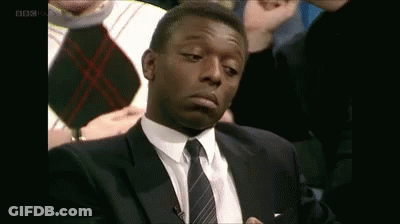 Man In Suit And Tie Making Face GIF