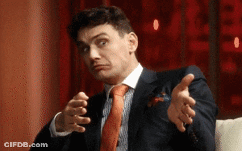 Man In Suit And Tie Making Face GIF