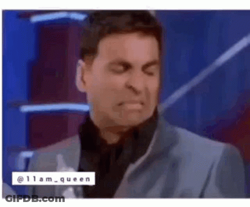 Man In Suit And Tie Making Face GIF