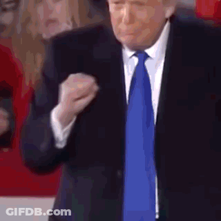 Man In Suit And Tie Making Fist GIF