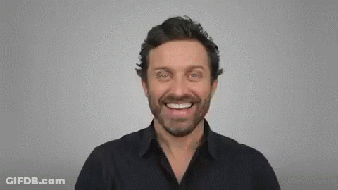 Man In Suit And Tie Making Funny Face GIF