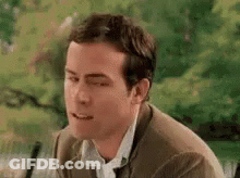 Man In Suit And Tie Making Funny Face GIF
