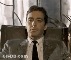 Man In Suit And Tie Making Funny Face GIF