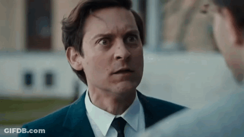 Man In Suit And Tie Making Funny Face GIF