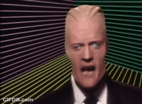 Man In Suit And Tie Making Funny Face GIF