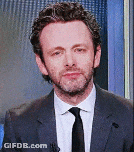 Man In Suit And Tie Making Funny Face GIF