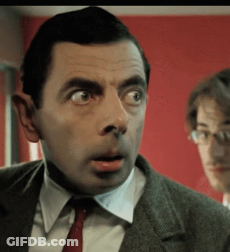 Man In Suit And Tie Making Funny Face GIF