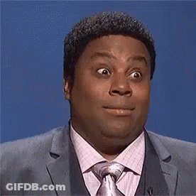 Man In Suit And Tie Making Funny Face GIF