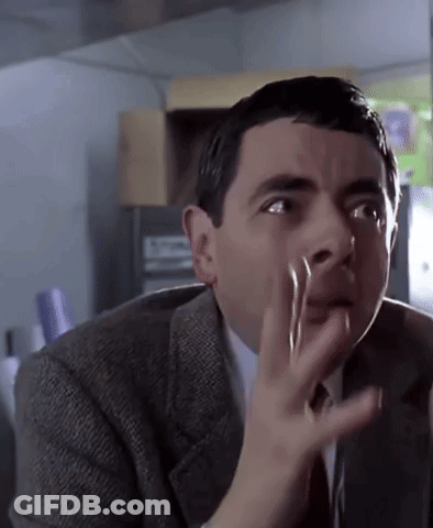 Man In Suit And Tie Making Funny Face GIF