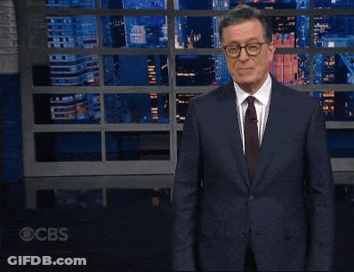Man In Suit And Tie Making Funny Face At CBS Screen GIF