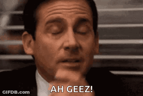 Man In Suit And Tie Making Funny Face At Window GIF