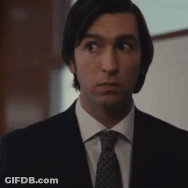 Man In Suit And Tie Making Funny Face GIF