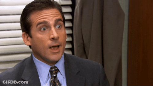 Man In Suit And Tie Making Funny Face GIF