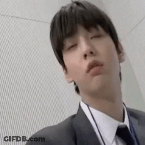 Man In Suit And Tie Making Funny Face GIF
