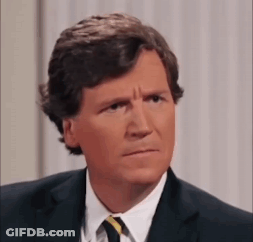 Man In Suit And Tie Making Funny Face GIF