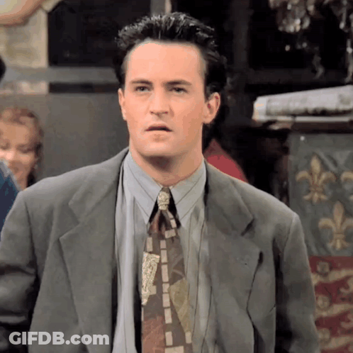 Man In Suit And Tie Making Funny Face GIF