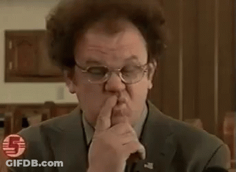 Man In Suit And Tie Making Funny Face Pointing At Camera GIF