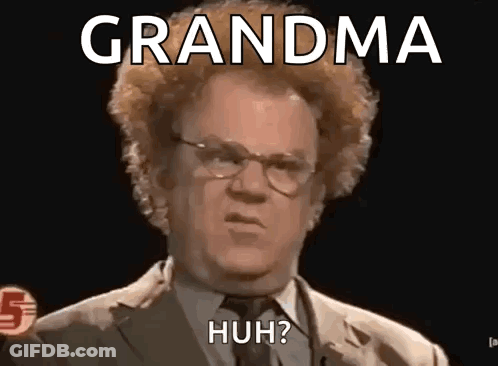 Man In Suit And Tie Making Funny Face Saying Grandma Huh GIF