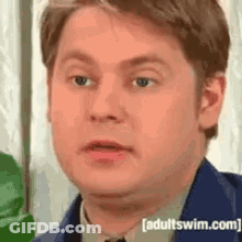 Man In Suit And Tie Making Funny Face GIF