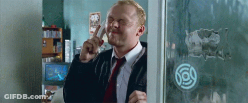 Man In Suit And Tie Making Funny Face Through Window GIF