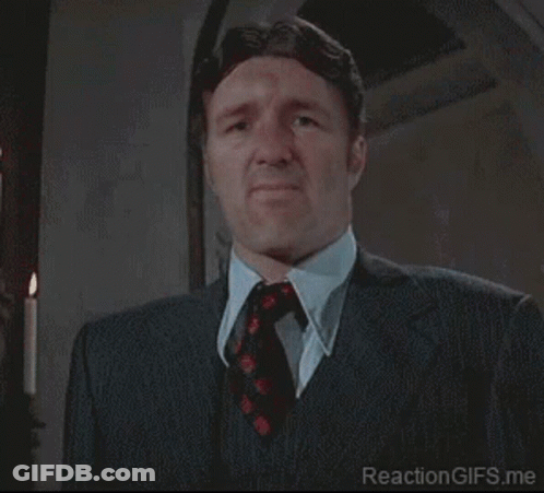 Man In Suit And Tie Making Funny Face GIF