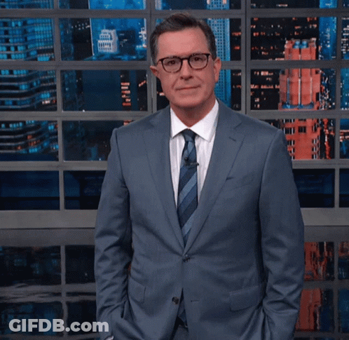 Man In Suit And Tie Making Funny Face GIF