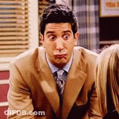 Man In Suit And Tie Making Funny Face GIF