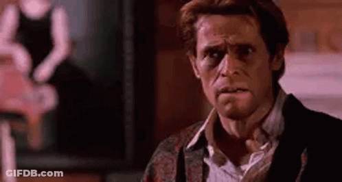 Man In Suit And Tie Making Funny Face GIF