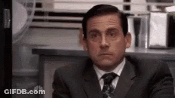 Man In Suit And Tie Making Funny Face GIF